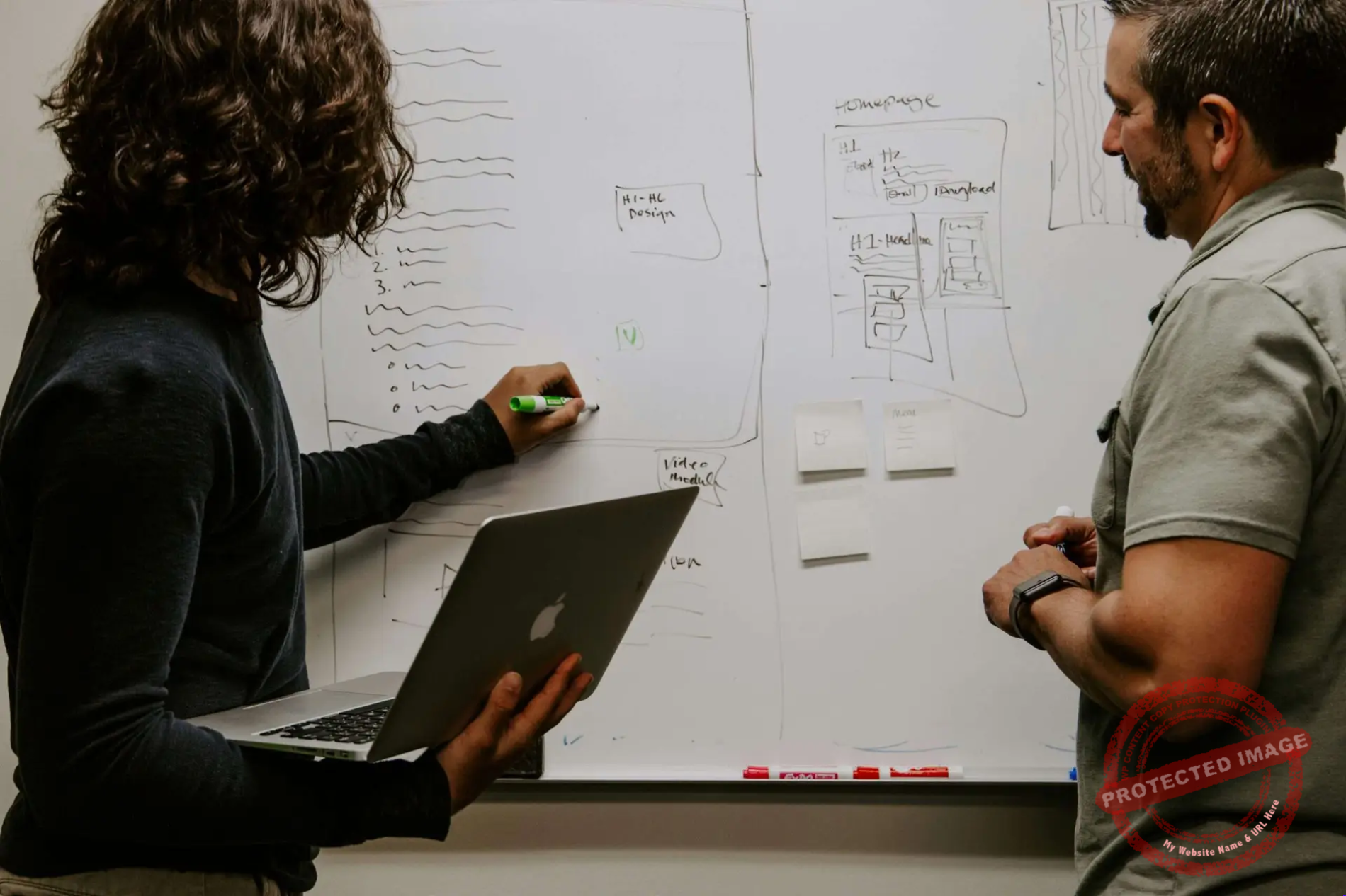 A researcher at a whiteboard explaining neural-network unlearning benchmarks to a team