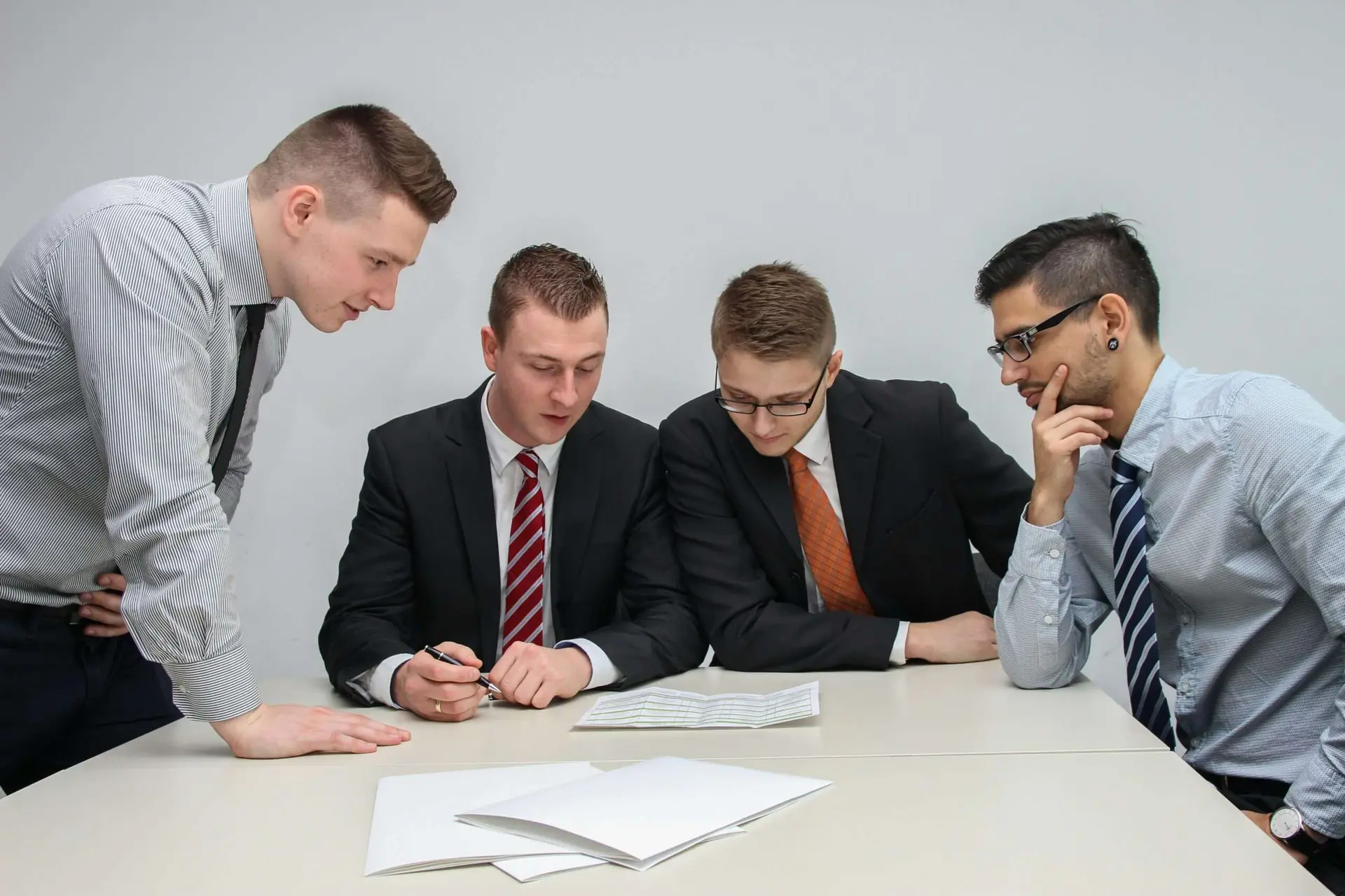 Professionals reviewing printed legal documents about the right to be forgotten and AI